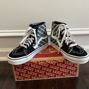 Vans- checkered pattern high tops.